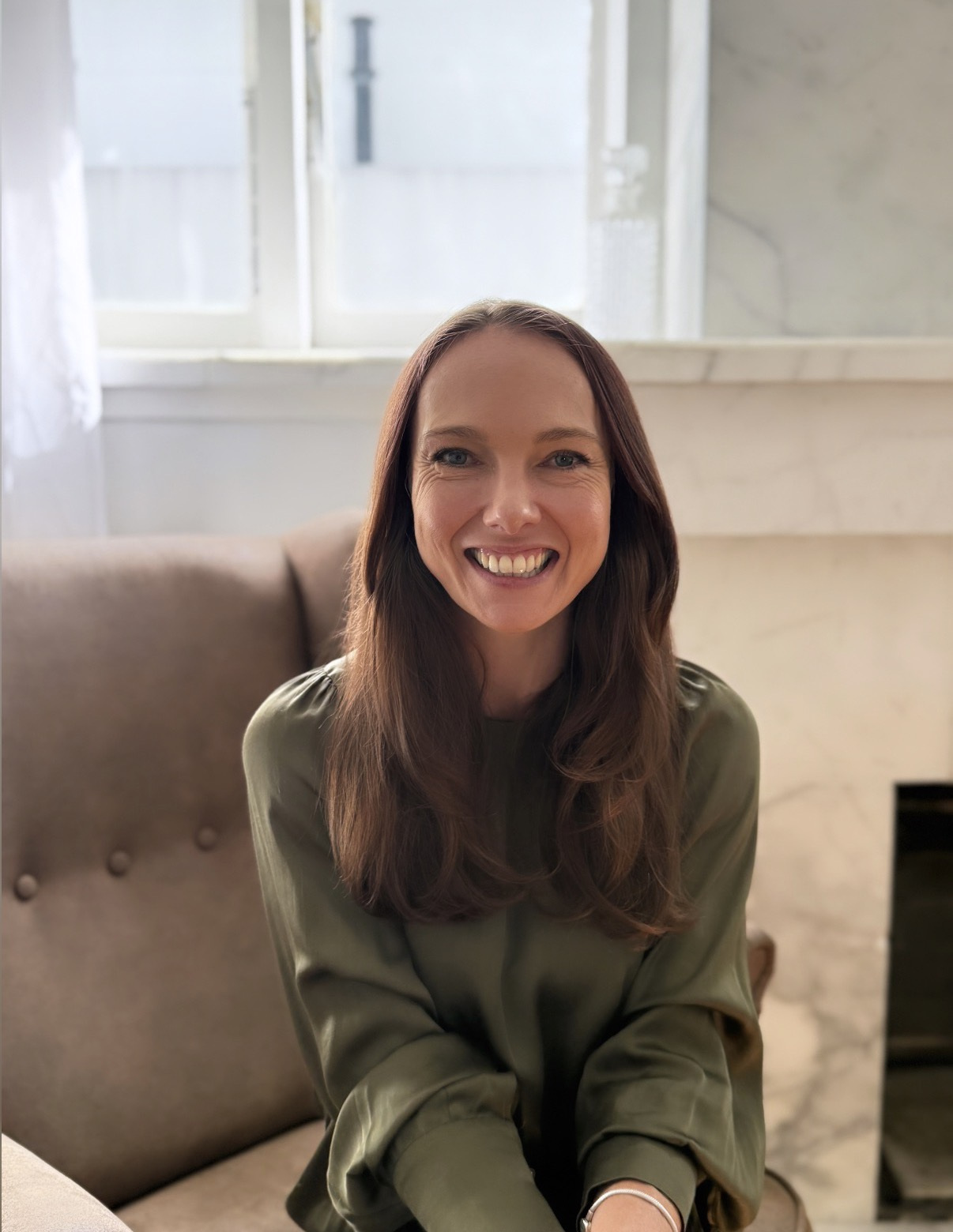 Aline founder seated in a welcoming counselling space